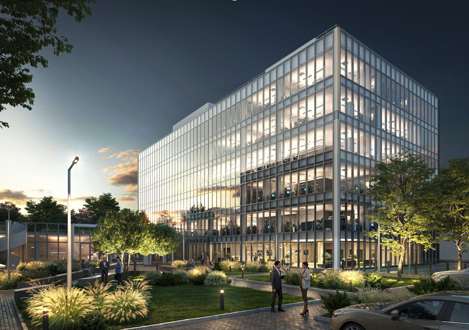 Office building with a glazed facade at dusk